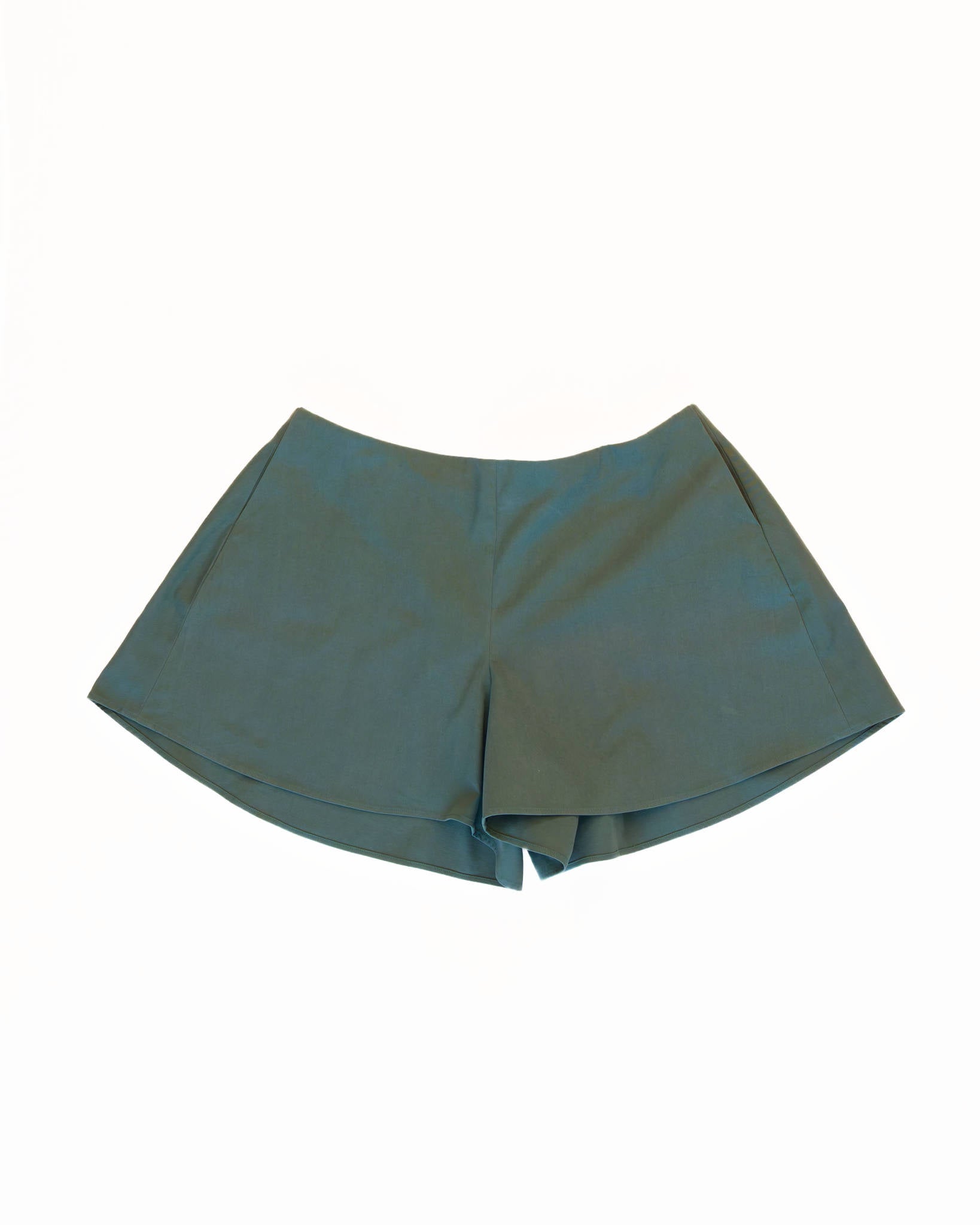 Front of teal skorts with pockets on a white background