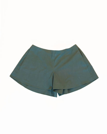 Front of teal skorts with pockets on a white background