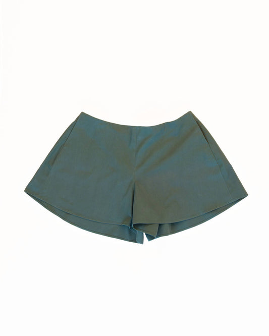 Front of teal skorts with pockets on a white background