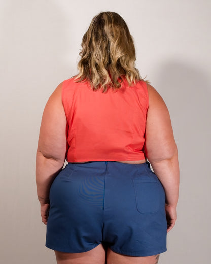 Back of Kingfisher A-line shorts in dark blue. Hidden zipper closure centre-back and a single back pocket on the right.