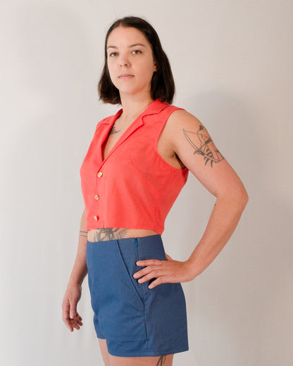 Sleeveless blouse in callistemon red styled with Kingfisher A-line shorts in blue.
