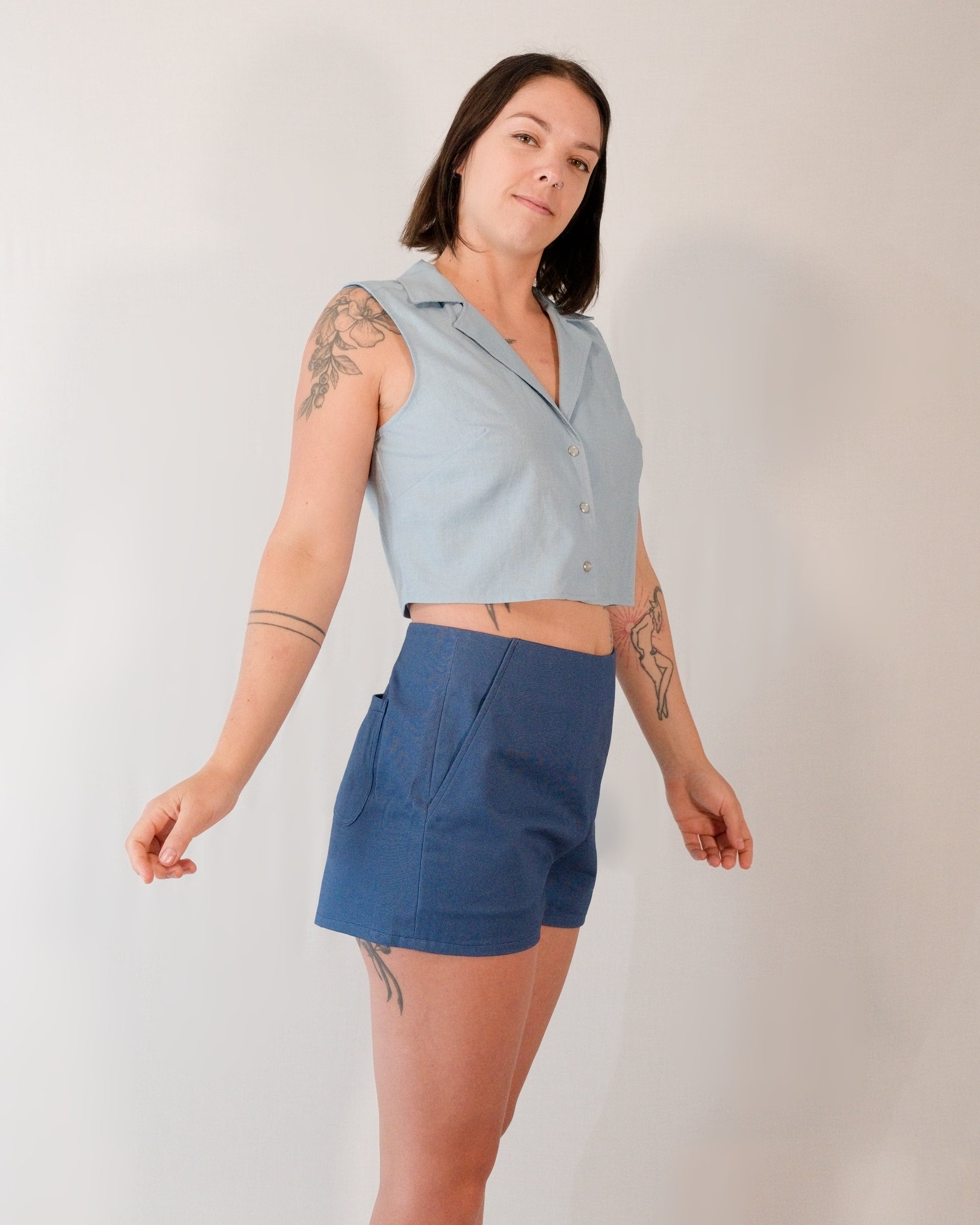 Sleeveless blouse in skyline blue styled with Kingfisher A-line shorts in blue.